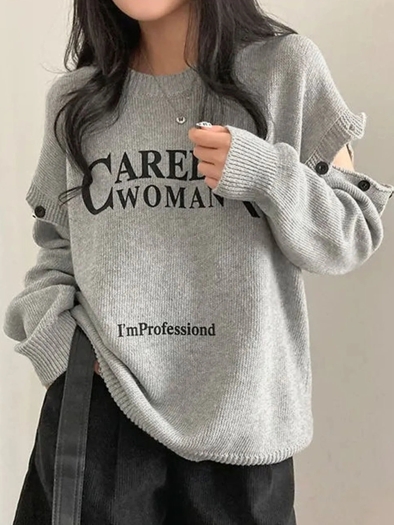Lettre rétro épaule imprimée et épaule du cou rond en tricot tricoté pull pour femmes automne et hiver de la mode de la mode.