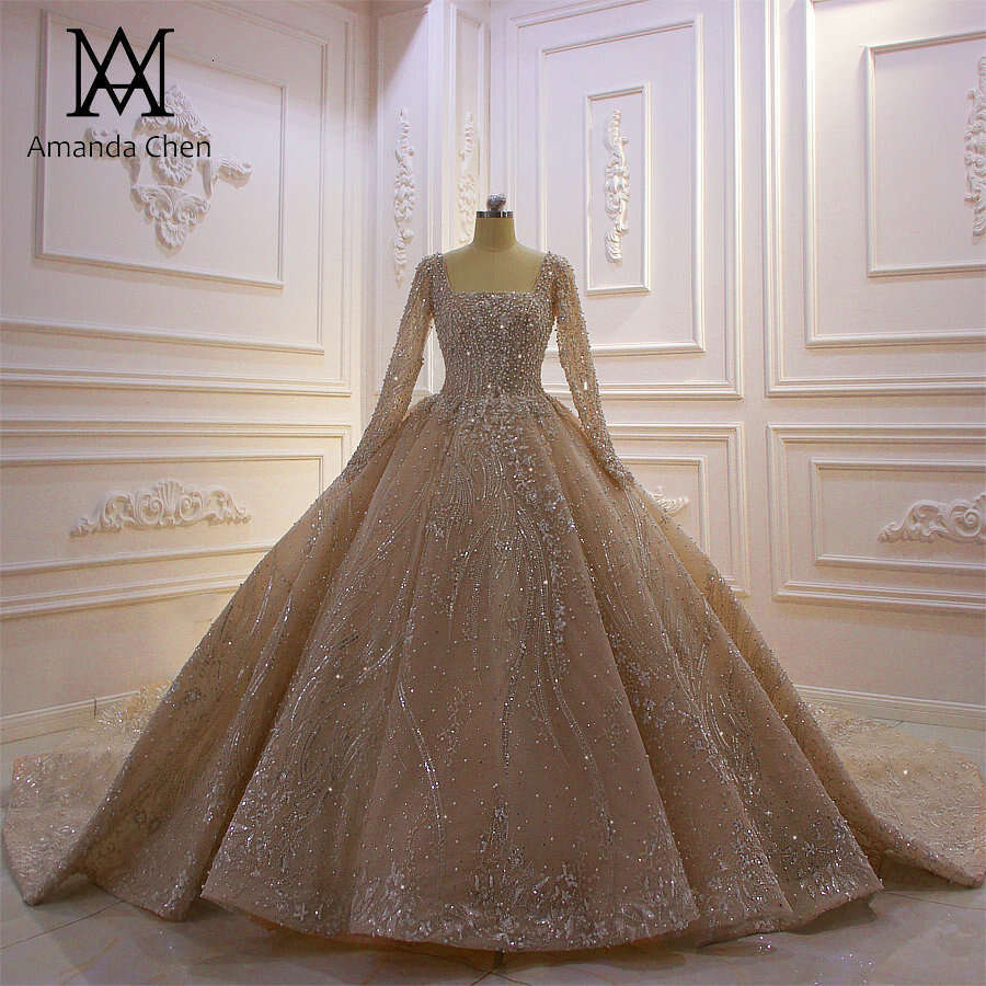 Amanda Novias à manches longues en dentelle appliquée perles champagne robe de mariée 2024