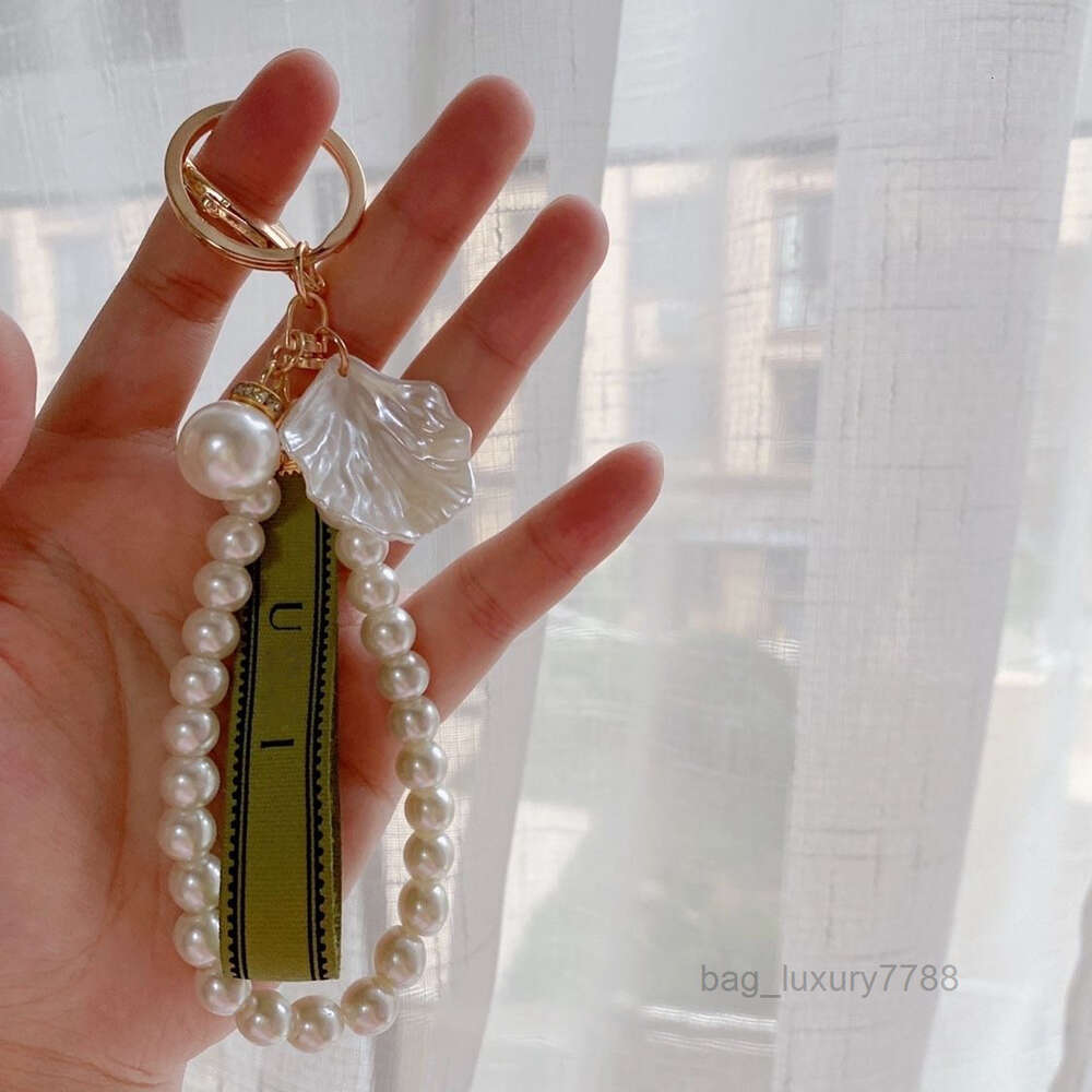 Designer keychain Luxury key chain bag charm female car key ring Pearl charm green ribbon delicate shells keychain couple pendant gift nice-image-902996874