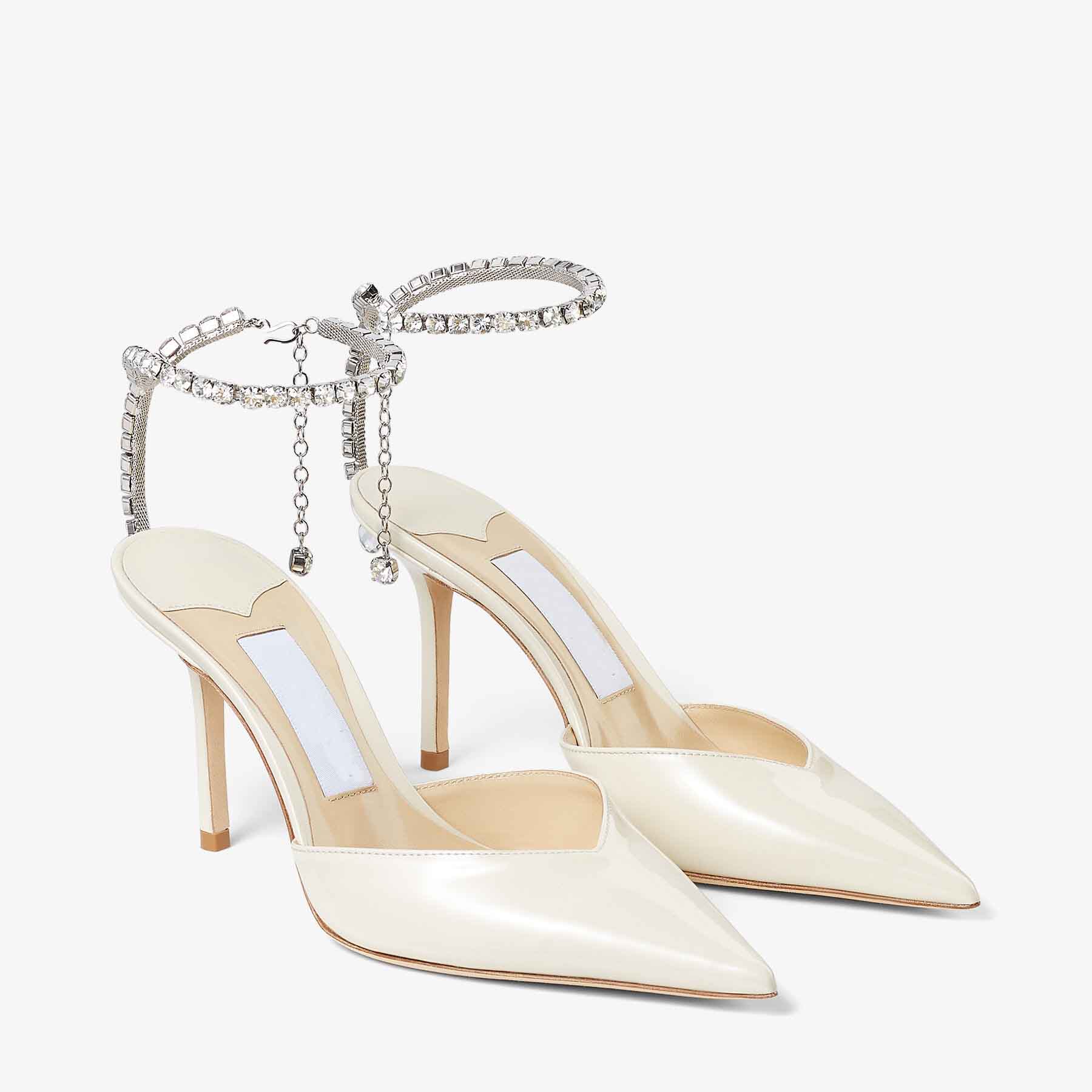 Marques de luxe Sandales d'été Femmes Saeda 100MM Pompe à talons en daim avec sangle en cristal Pompes à talons hauts Robe de mariée à talons hau