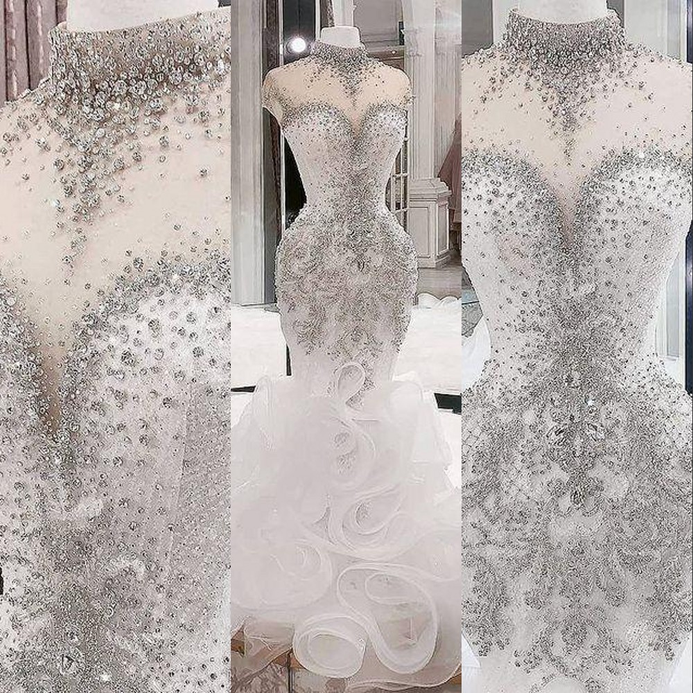 

2023 Luxurious Mermaid Wedding Dresses Arabic Silver Beaded Crystals High Neck Ruffles Tiered Plus Size Bridal Dresses Sheer Neck Bridal Gowns Hollow Back, White