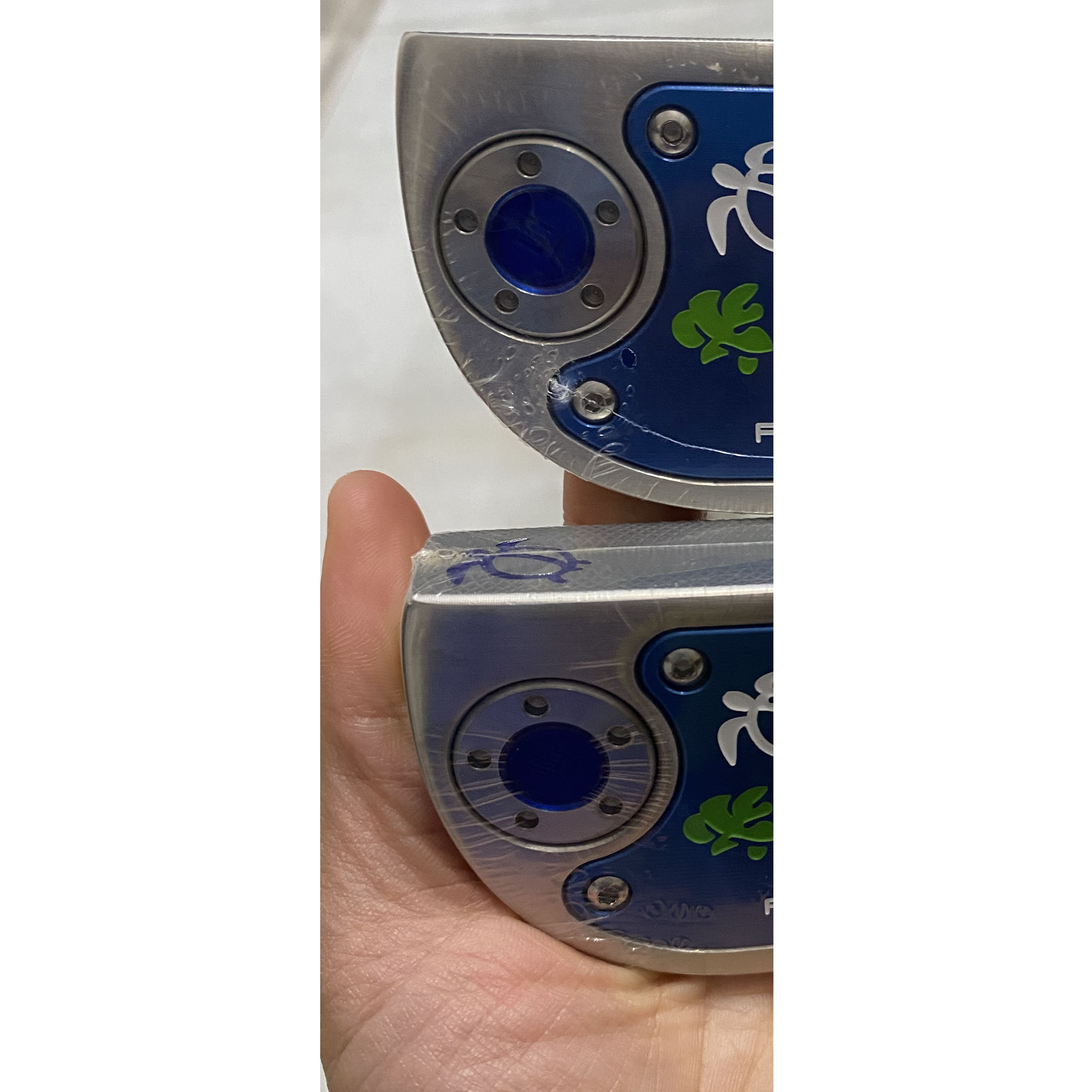 

Half round golf putter with head cover and removeable screw