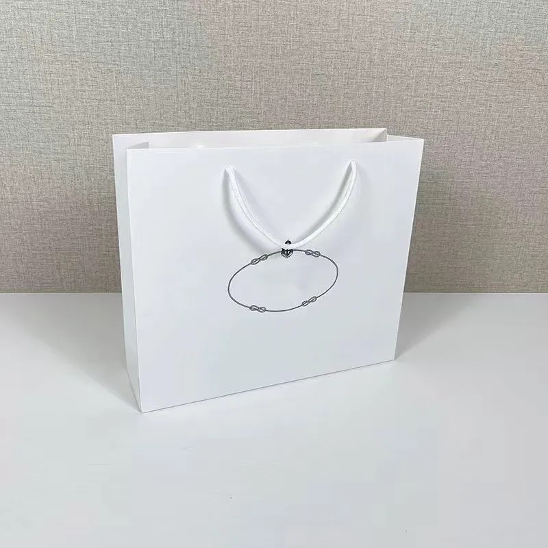 Sac en papier pour bijoux, boîte à bagues, boîte à bijoux universelle, sac d'emballage de styliste, sac de créateur de jupe, vente en gros