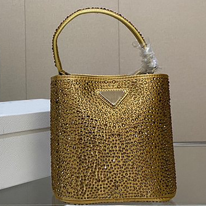 

Panier satin bag with crystals leather handle Detachable adjustable shoulder strap Metal hardware Enameled triangle logo front Magnetic clasp closure handbag, Gold