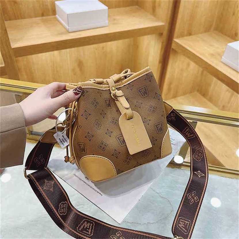 

handbag 2023 Fashion women's bag leather quality Handbag Spring printed small women's sense bucket Shoulder Messenger Bag, Brown4