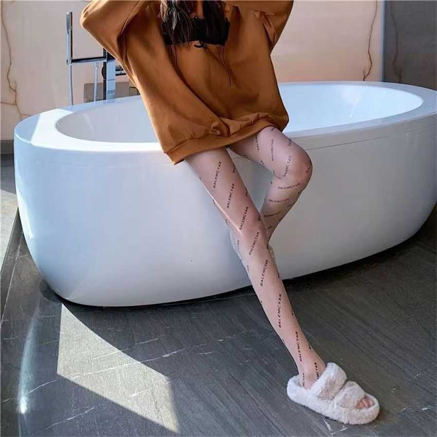 

Summer thin black letter silk stockings sexy random cut printed tights spring and autumn net red Paris socks bareleg artifact