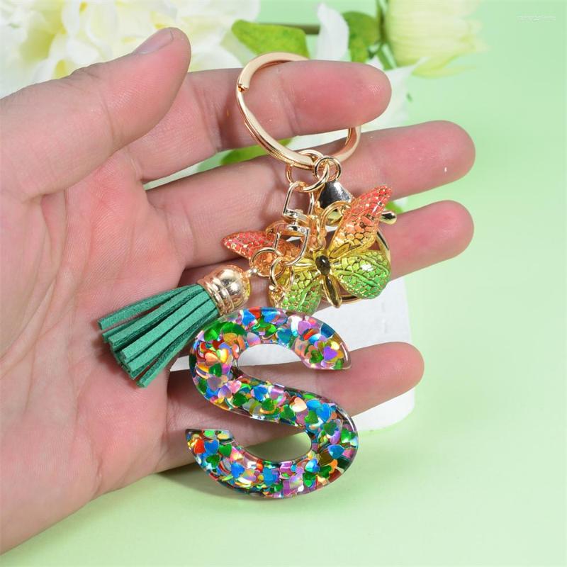 

Keychains Fashion Butterfly Pendant 26 Letter Keychain Heart Sequins Filled A-Z Initial Key Chains With Tassel Bag Charms Accessories Gift