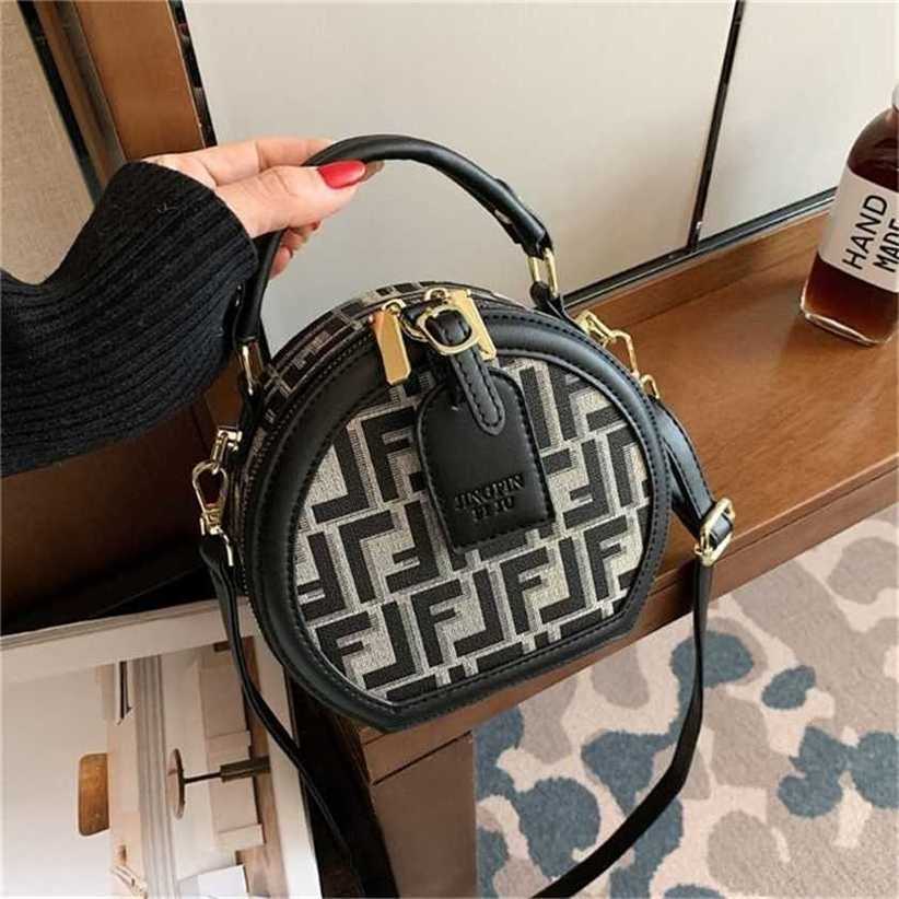 

handbag 2023 Fashion women's bag leather quality Handbag Spring trend small round cake Korean version printed large capacity women's shoulder Bag, One black