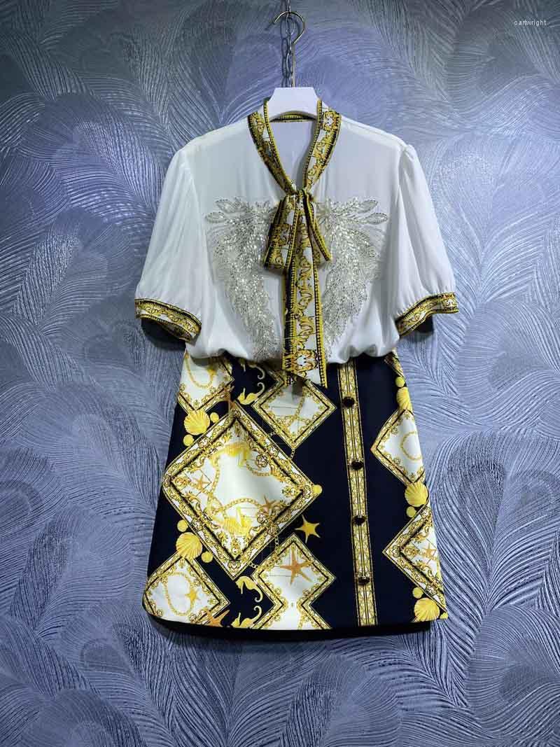 

Work Dresses Runway 2023 Summer Women Golden Chains Starfish Printed Skirt Set Bow Beading Short Sleeve Tops Mini 2 Pieces B130, Picture shown