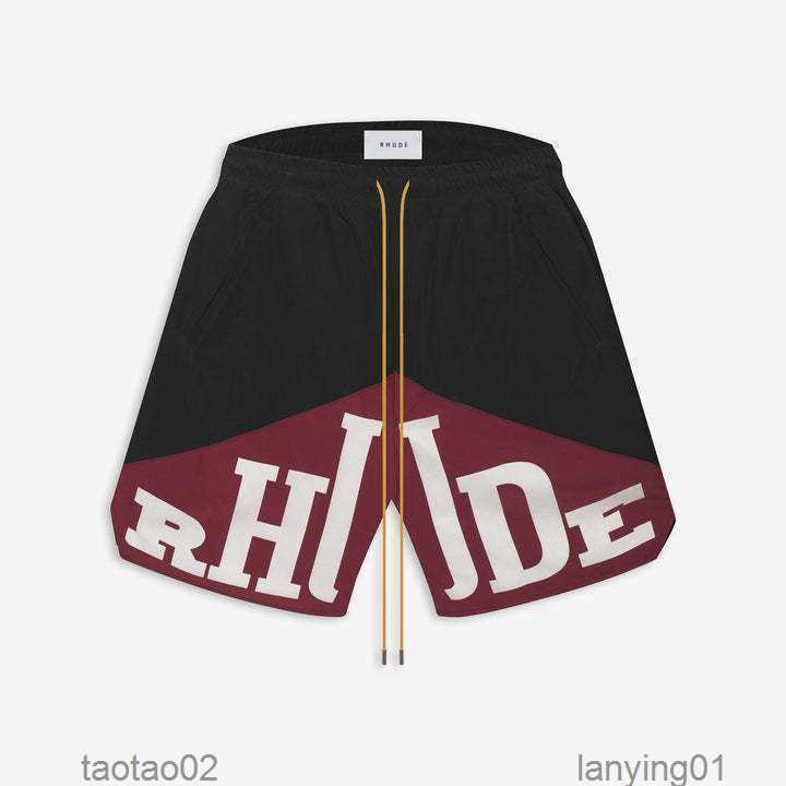 

Mens Summer Designer Rhude Beach Swimming Loose Shorts Swim Short Fashion Retro Letter Printed Drawstring Two-color Spliced Rope38ja