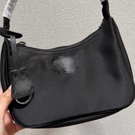 

designer bags re-edition Small armpit stick triangle logo women's nylon cloth portable shoulder small new fashion, Fairy powder
