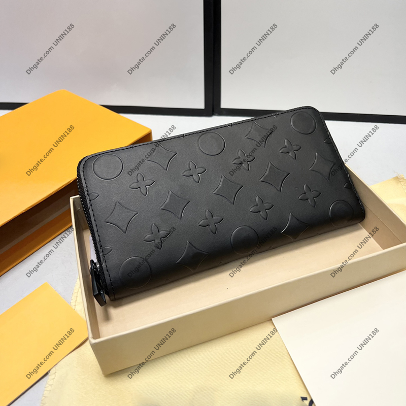 

Mens Luxurys Designers Bags Long Wallet Zippy Handbag Solid color Raised Relief Bag Genuine Leather Ladies Travel Wallets With original box, Black