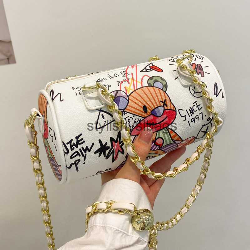 

Totes 2023 new Cartoons Graffiti Cylindrical Pu Leather Zipper Crossbody Bags For Women Chain Shoulder Handbags And Purses Lady 031723H, Beige