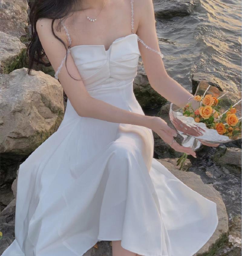 

Casual Dresses Vintage Elegant White Dress Women Slash Neck Crystal Camisole Sheath Sleeveless Off Shoulder Party Bodycon Vestido 2023