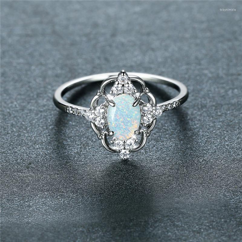

Wedding Rings White Blue Opal Oval Stone Ring Dainty Silver Color Vintage Hollow Flower Engagement For Women Bridal Jewelry