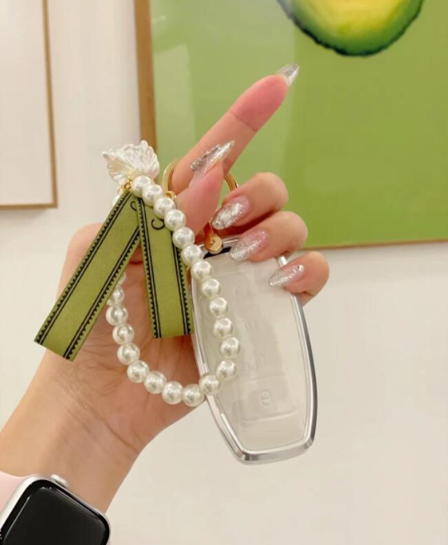 

Fashion designer female keychains mobile phone chain Vintage Lily of the Valley compact cute pearl alloy love butterfly