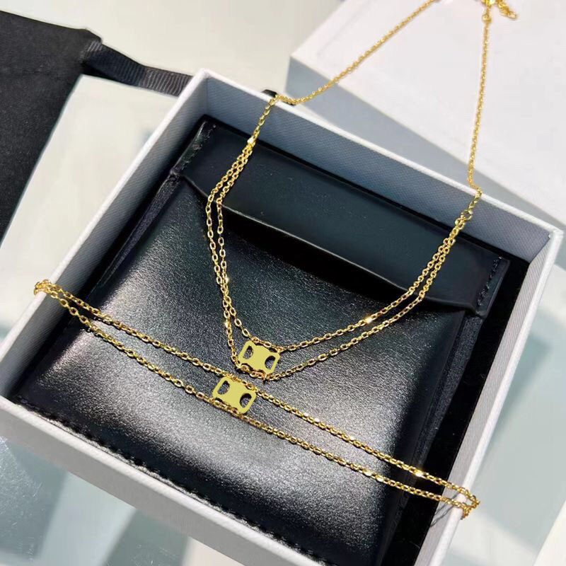 

Gold plated long womens love Triangle necklace simple style double deck ins elegant pendant necklaces luxury thin chain brass dangle designer bracelets hip hop
