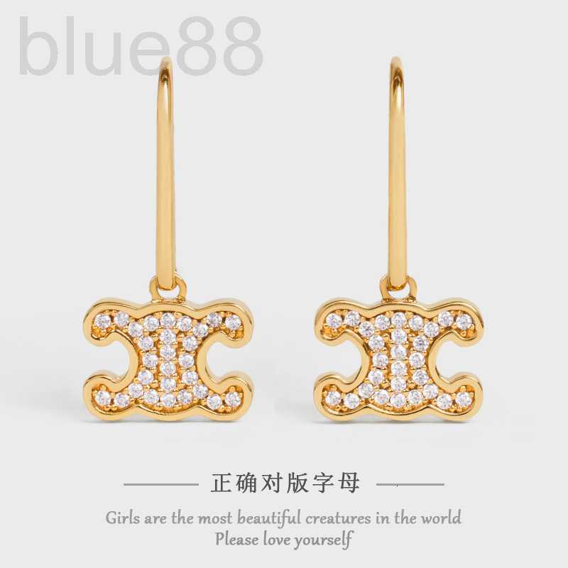 

Charm designer Autumn and Winter New Simple Hollow Arc de Triomphe Earrings Women's Diamond Embedding Fashion Pig Nose 3140