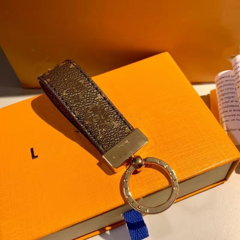 

2023 Luxury designer Keychain with orange box Men'S Waist Buckle Leather Presbyopia Keychain Pendant Car Key Chain Ring Fashion Couple Creative Gift