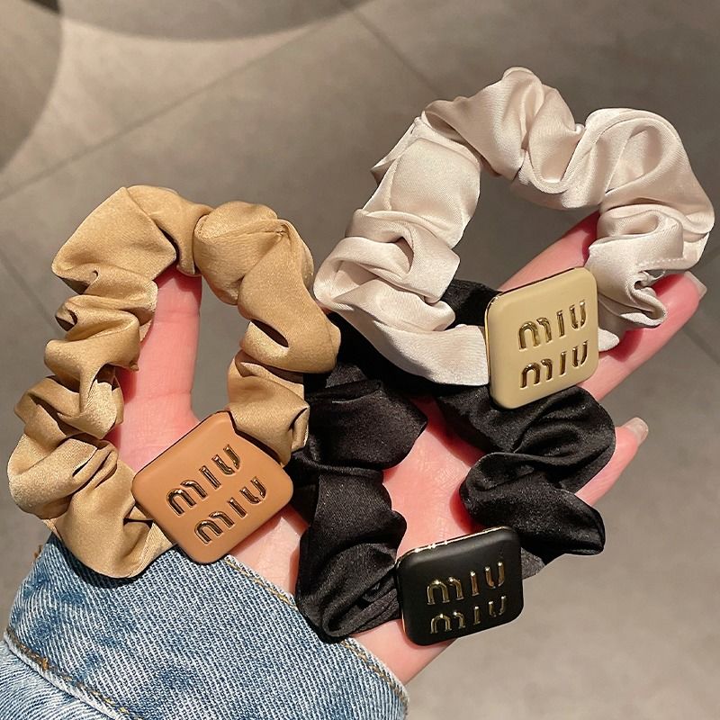 2023 new fashionable high-end sense miu letter head rope large intestine balls hair circle simple high-end ponytail leather band women's tie
