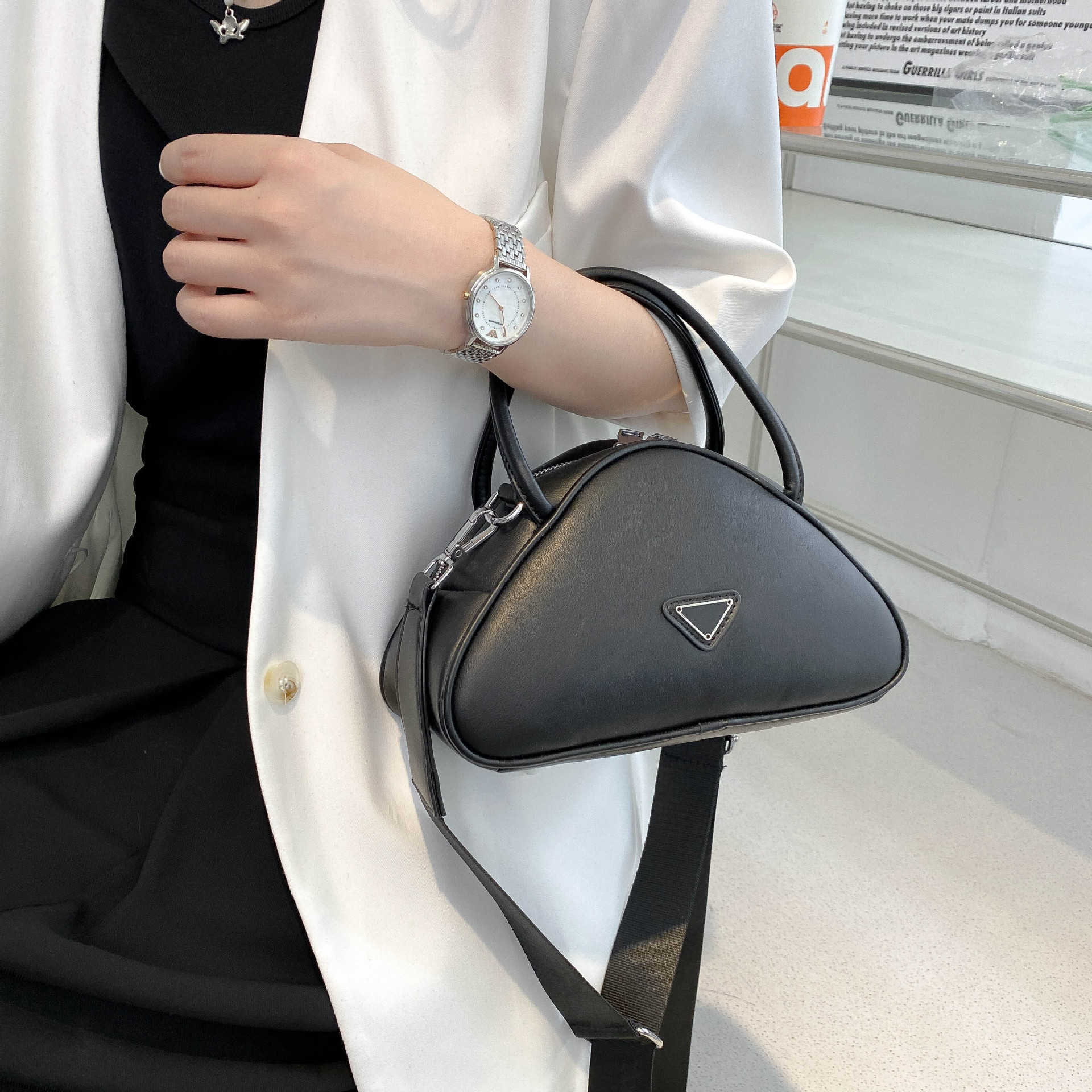 

2023 Fashion New internet celebrity Women's soft leather bowling handbag Embossed wide shoulder strap Triangle portable diagonal cross bag, White9