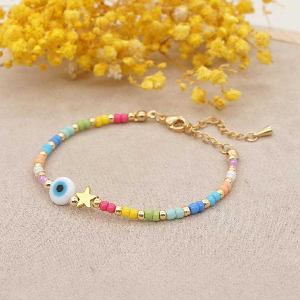 

Bohemian Ethnic Style Charm Glass Eye Beads Xingx Small Rice Shaped Rainbow Wholesale Womens Bracelet