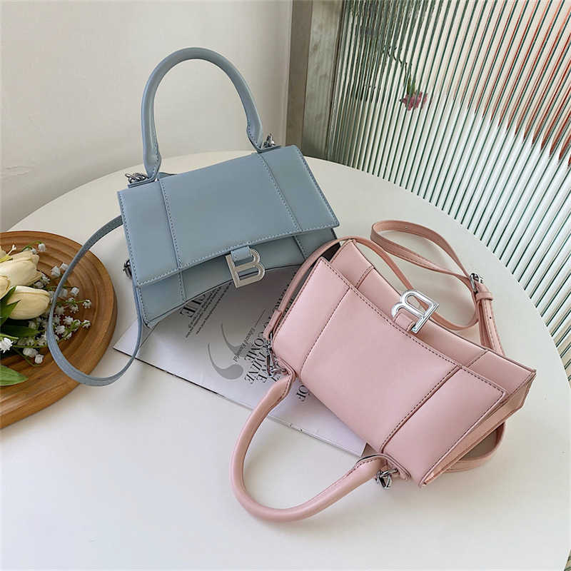 

2023 Fashion handbag New Handbag Shoulder Fashionable and Versatile Hourglass Plain Pattern Advanced Women's Bag, White10