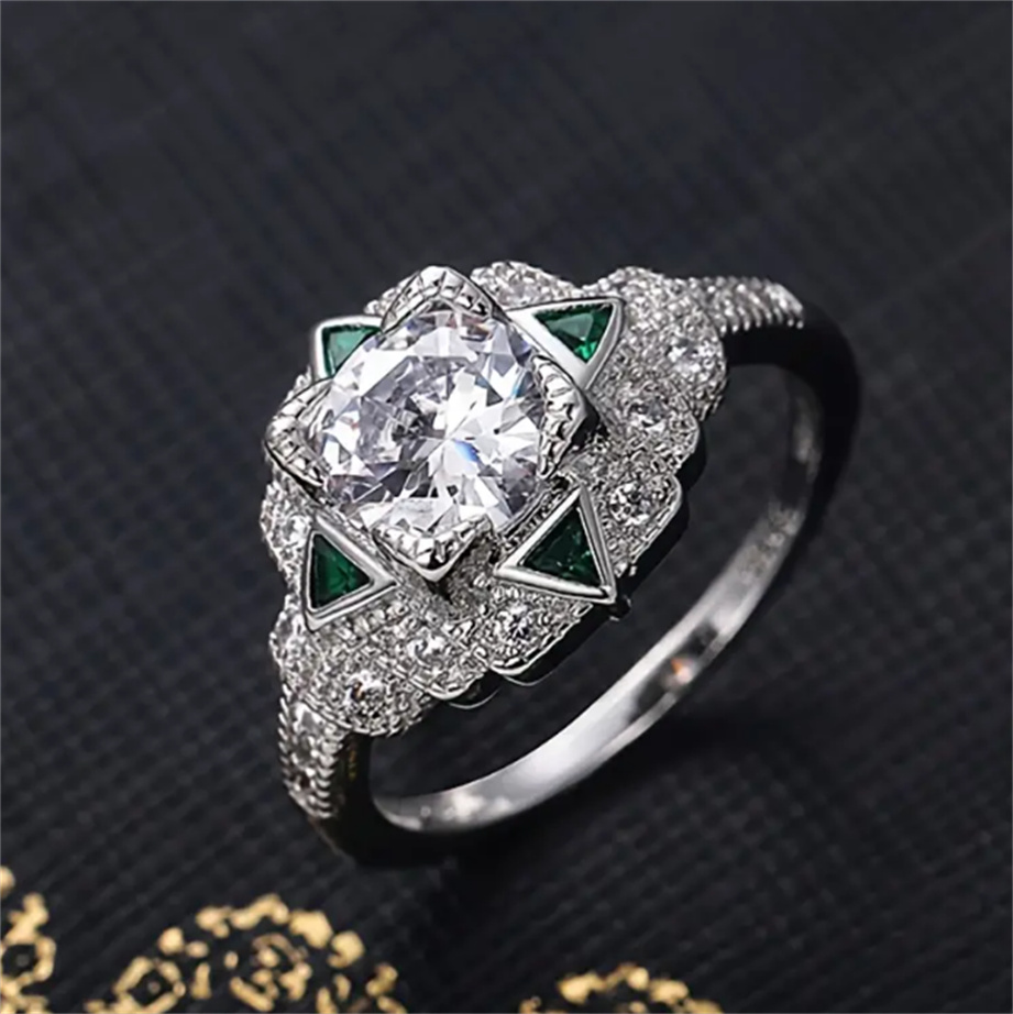 

Gorgeous Retro Silver Ring with Round Cubic Zirconia and Emerald Triangle - Perfect for Everyday Wear!