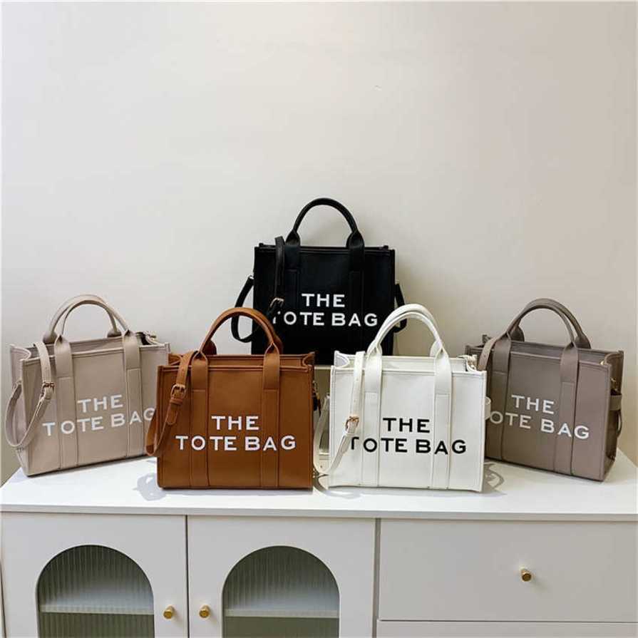 

17% OFF 2023 handbag French Simple Tote New Fashion Stamping Letter THETOTEBAG One Shoulder Crossbody Bag for Women, White7