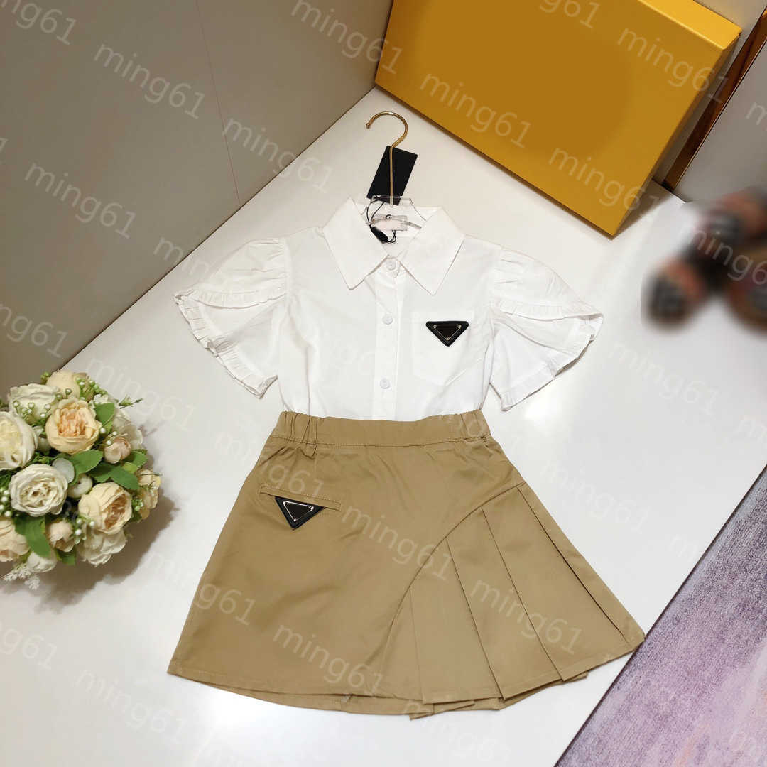 

23ss kid sets kids designer clothes t shirt Skirt suit Breast pocket lapel Short sleeve shirt Patchwork pleated skirt suits High quality kids clothes