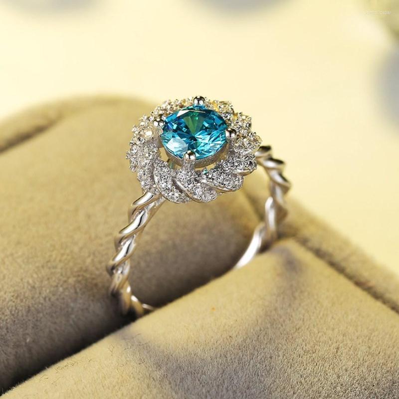

Wedding Rings Fashion Simple Rotating Flower Ring Blue Zircon Silver Plated Bridal Engagement Party Jewelry Size Us6-9