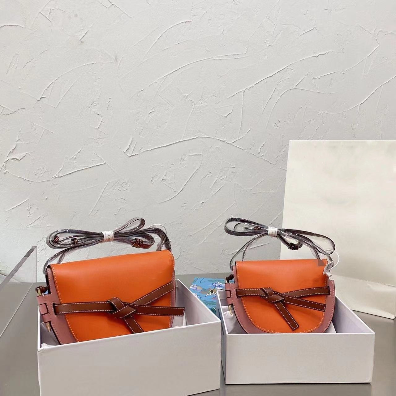 

Puzzles Designer Saddles Bag Women's Shoulder Handbag High Version Leather Clamshell Bow Vintage Wallet Fashion Luxury Strap Crossbody bag