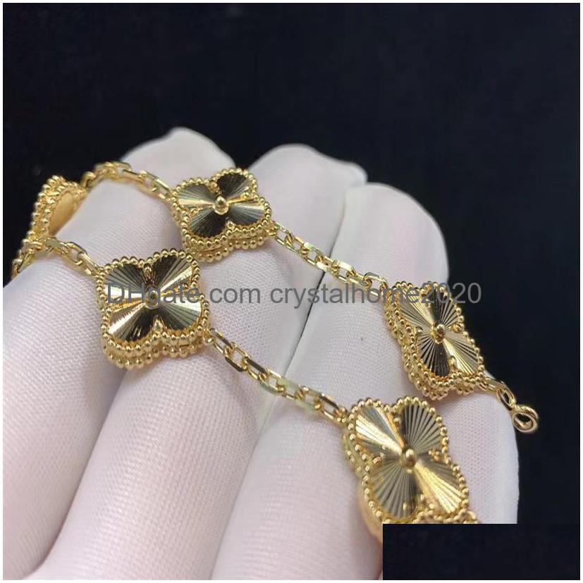 

Charm Bracelets Luxury Van Clover Designer Bracelet Pearl 4 Leaf 18K Gold Laser Brand Bangle Necklace Earrings Diamond Wedding A Dro Dhjkz