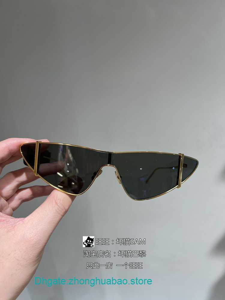 

Designer Sunglasses Brand Y S L for women and men in Paris France with light gold frame gray cat eye trendy sunglasses