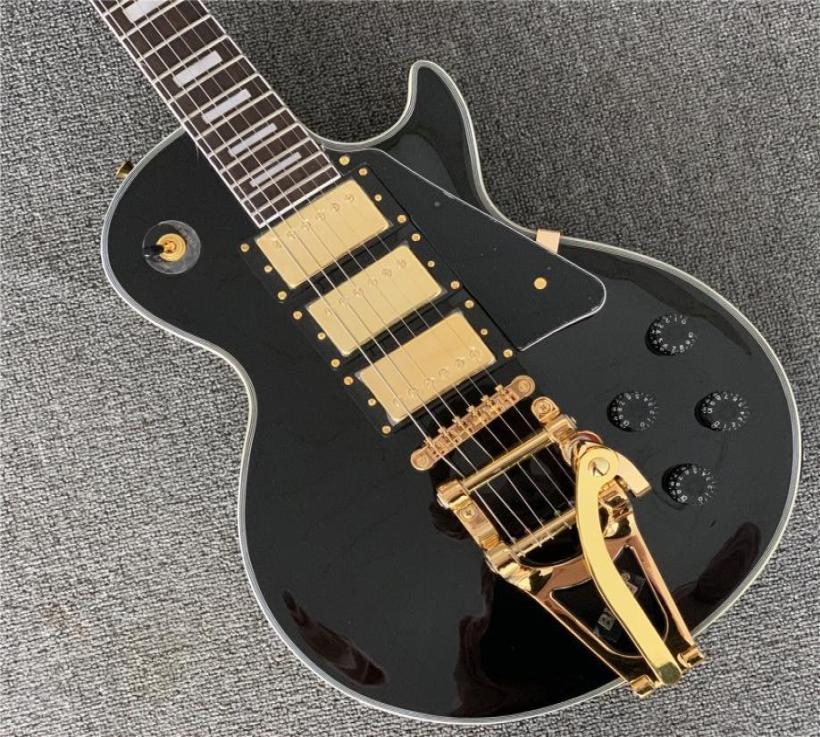 

3 Pickups Custom Shop Electric guitarSolid Mahogany body With Black paint and yellow bindingGolden Hardware5885163