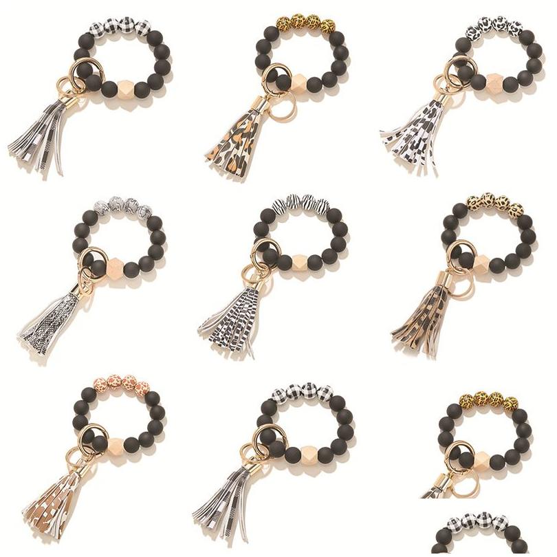 

Keychains Lanyards Frosted Wooden Beaded Keychain Leopard Tassel Pendant Ladies Wrist Bracelet Key Chain Fashion Jewelry Keyring D Dherv