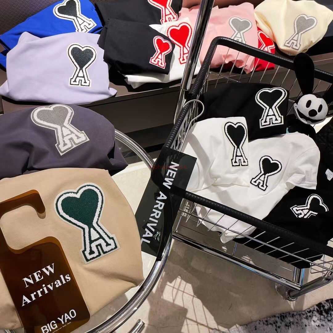 

Ami Designer Fashion Clothing Tees Tshirts High Version Amy Embroidered Fabric Stickers with Unisex Combed Cotton T-shirts for Couples Short Sleeves, Light colored large black heart