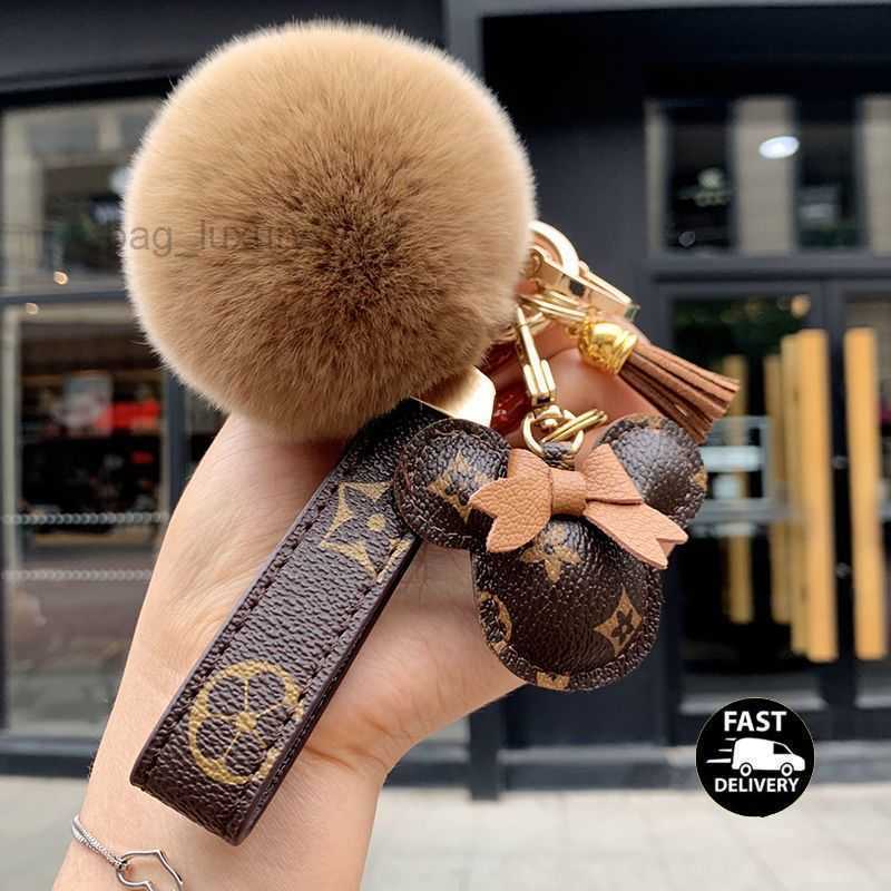 

Designer keychain bear head leather fur ball pendant key chain bow car pendant metal fashion personality creative cute