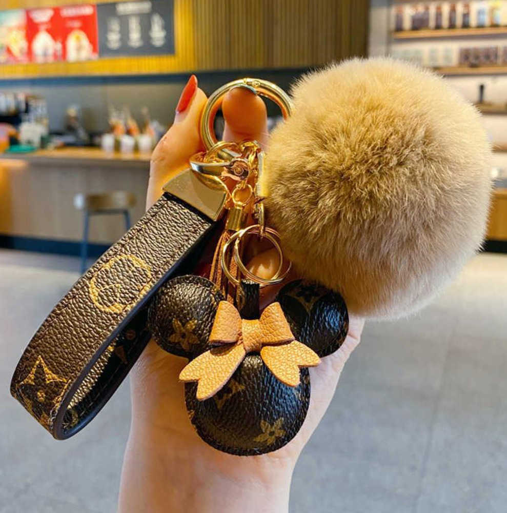 

Keychains Lanyards Fashion Car Keychain Favor Mouse Flower Bag Purse Pendant Charm Brown Keyring Holder For Men Gift PU Leather Lanyard Key Chain Motion current 78