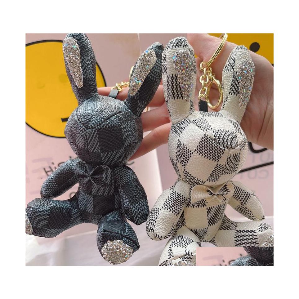 

Key Rings Animal Rabbit Keyrings Pu Leather Luxury Rhinestone Chains Jewelry Fashion Black Brown Flower Plaid Design Pendant Bag Cha Dhl6I