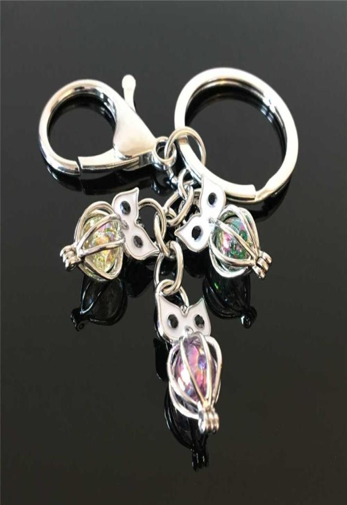 

EuroAmerican owl pearl cage key ring can open hollow noctilucent volcanic stone pendant keyrings2579566