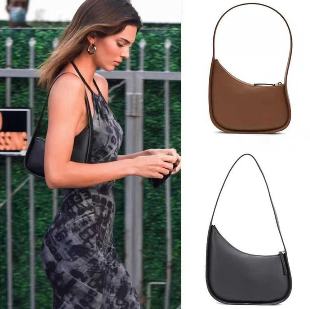 

The Row Half Moon Bag In Smooth Leather Women Designer With Flat Shoulder Strap And Curved Zipper Closure Clutch Tote Suded Lining Underarm, White