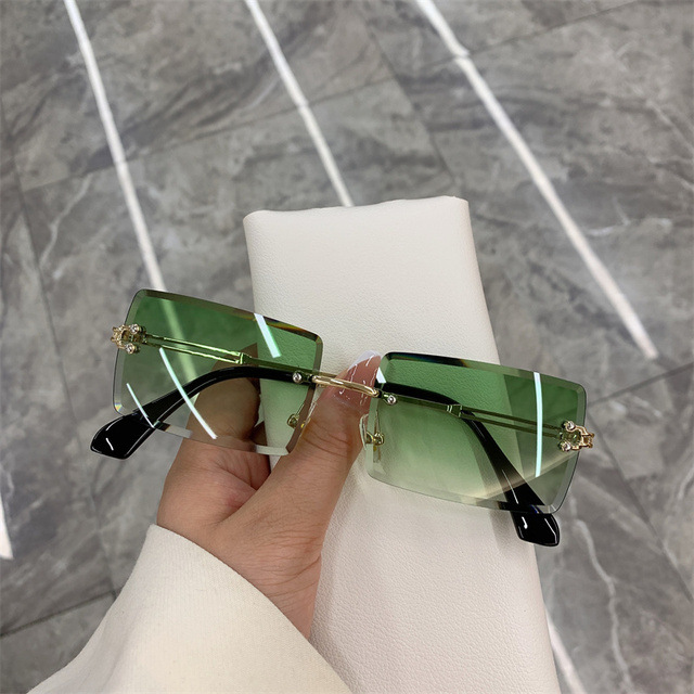 

New sunglasses for men and women rimless leopard-headed sunglasses cross-border European and n trend personality sunglasses Golden framed green tea tablets
