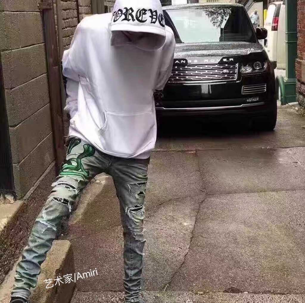 

Designer Clothing Luxury Casual Fashion Denim Pants Artist Amiiri Green Snake Washed Damaged with Splash Ink Embroidery Sticker Snake Skin High Street High Elastic