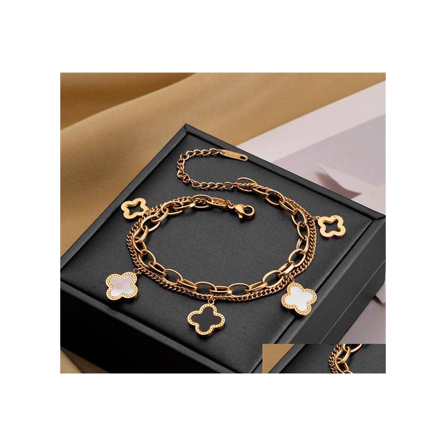 

Charm Bracelets 2022 European And American Fashion Titanium Steel Bracelet Womens Fourleaf Clover Doublelayer Chain Highend Nonfadin Dhqjj