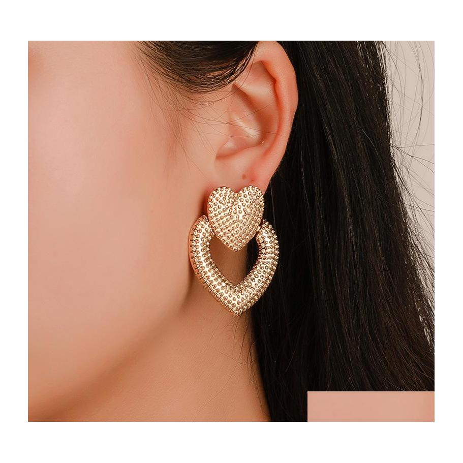 

Stud Fashion Jewelry Heart Earrings Hollowed Metal Double Peach Drop Delivery Dhqju