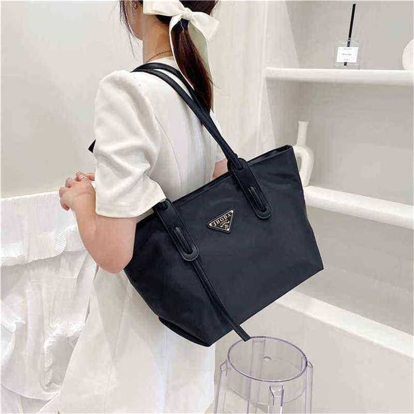 

22% OFF Handbag High quality 2023 new bag triangle classic canvas shoulder large capacity tote shopping nylon portable, White5