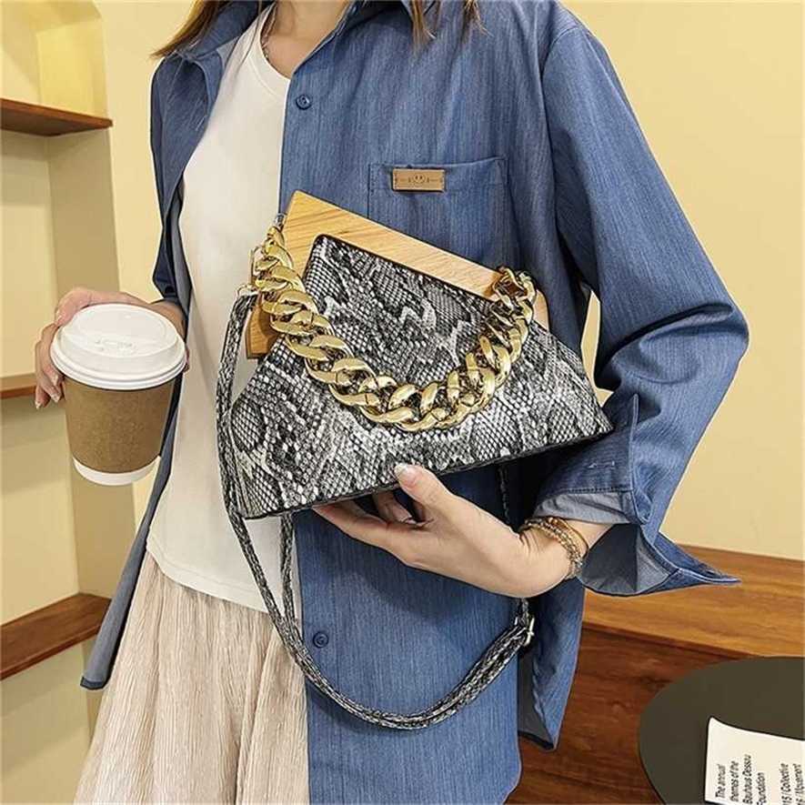 

28% OFF Handbag High quality 2023 new bag simple shell Shoulder Messenger popular clip buckle women's, Serpentine silver