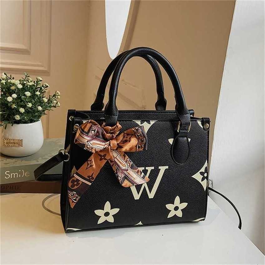 

22% OFF Handbag High quality 2023 new bag women's large capacity portable Tote minority French shoulder style texture messenger, Khaki7