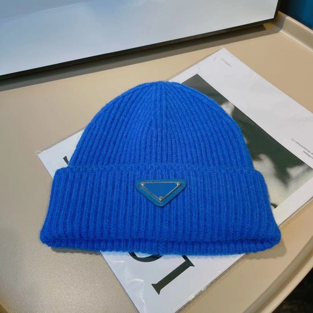 

Designer triangle knitted wool hat Men's and women's autumn and winter fried street short hat, Blue
